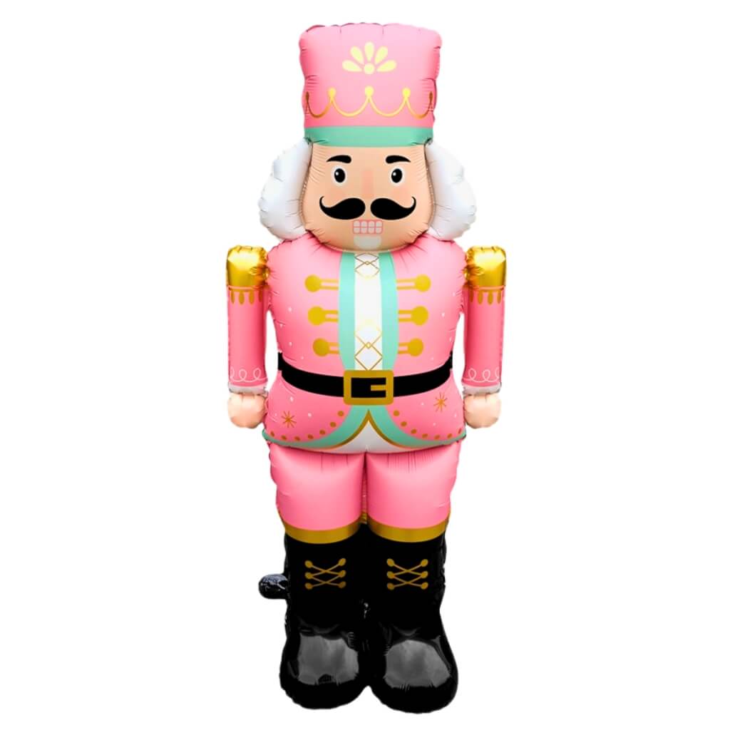 Inflatable nutcracker toy in pink costume on a white background