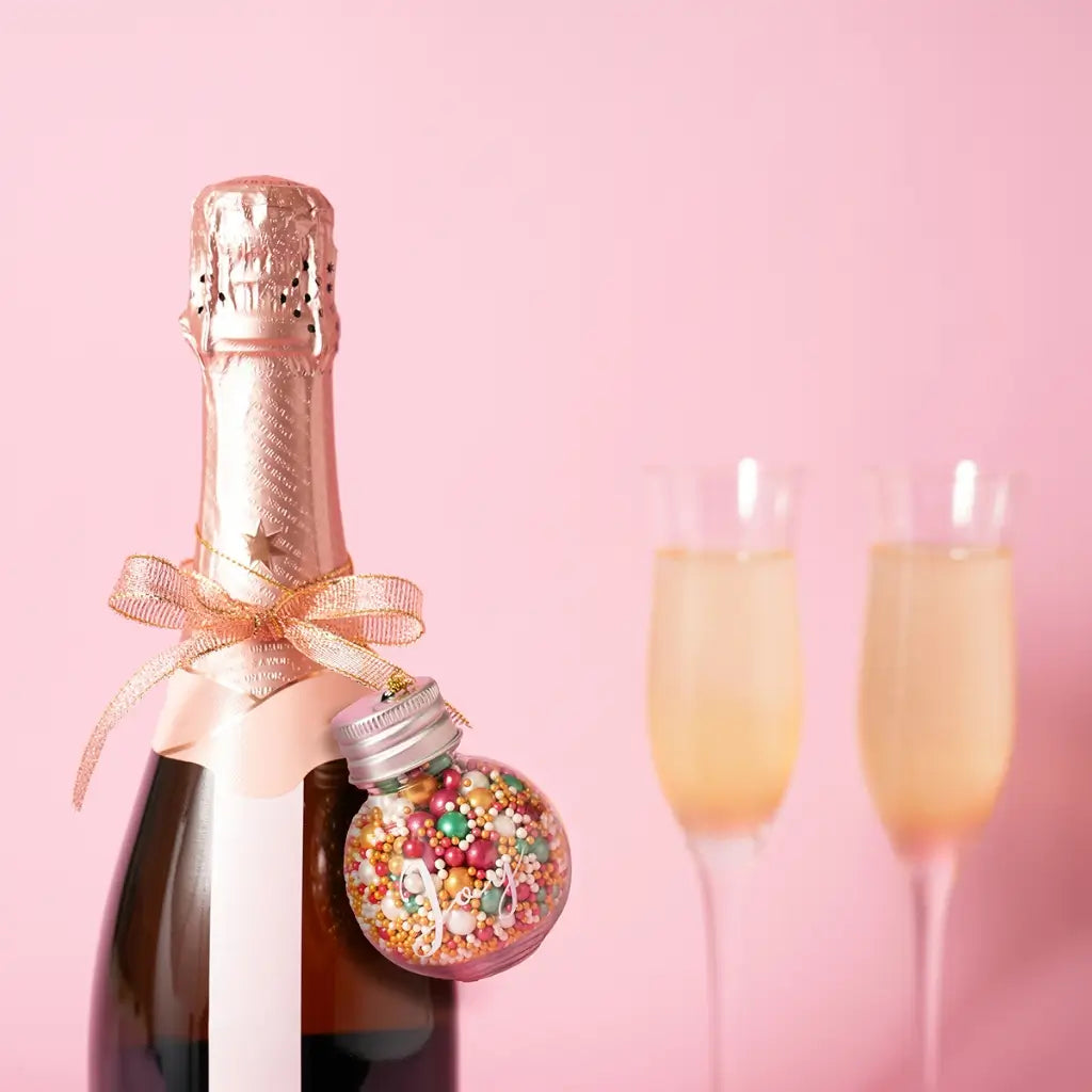 Sprinks Merry Minis festive baking gift in a reusable glass bauble on bottle