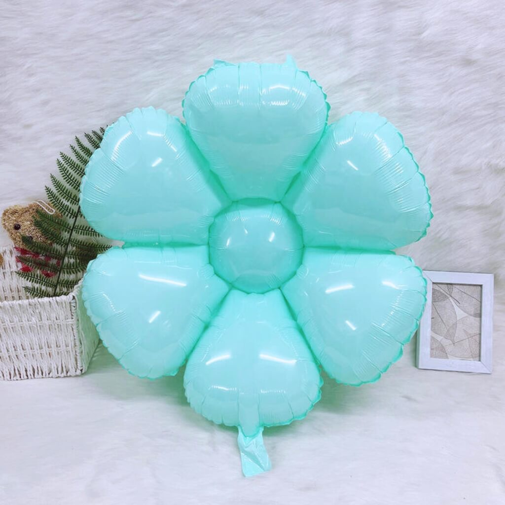 Light blue flower-shaped balloon on a white background