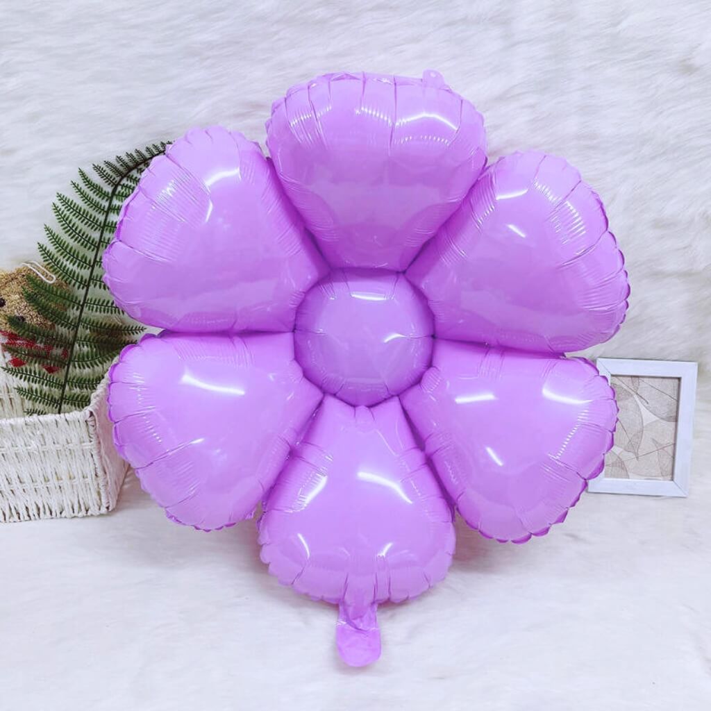 Purple flower-shaped balloon on a light background