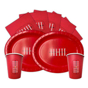 Red paper plates and cups with decorative cutouts on a white background