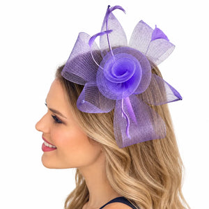 lavender fascinator with sculpted mesh loops and a layered flower centre