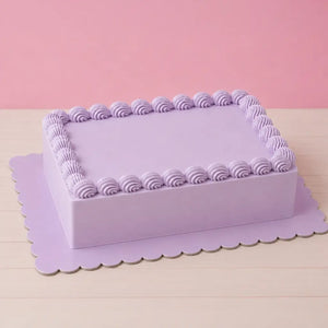 Papyrus pastel blue rectangular cake board supporting a decorated cake