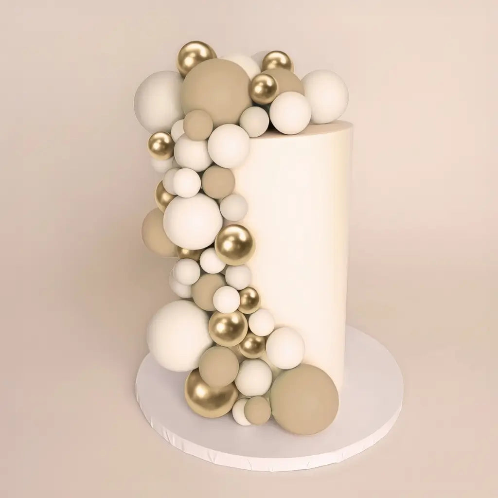 champagne gold cake ball toppers set on cake