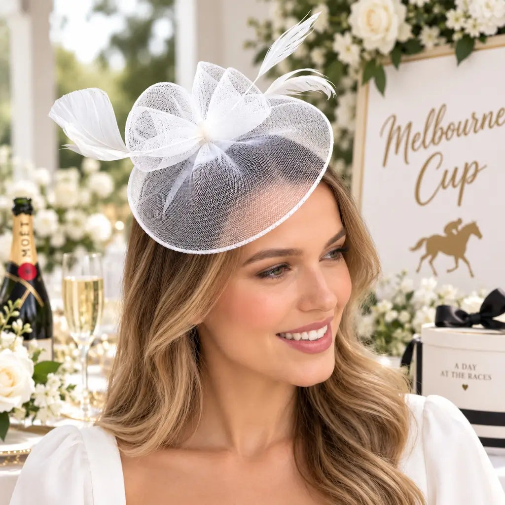 White feather fascinator headpiece suitable for weddings and bridal events