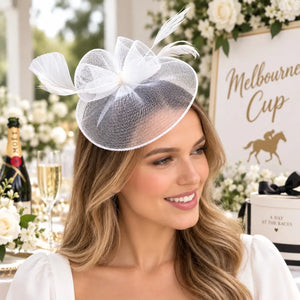 White feather fascinator headpiece suitable for weddings and bridal events