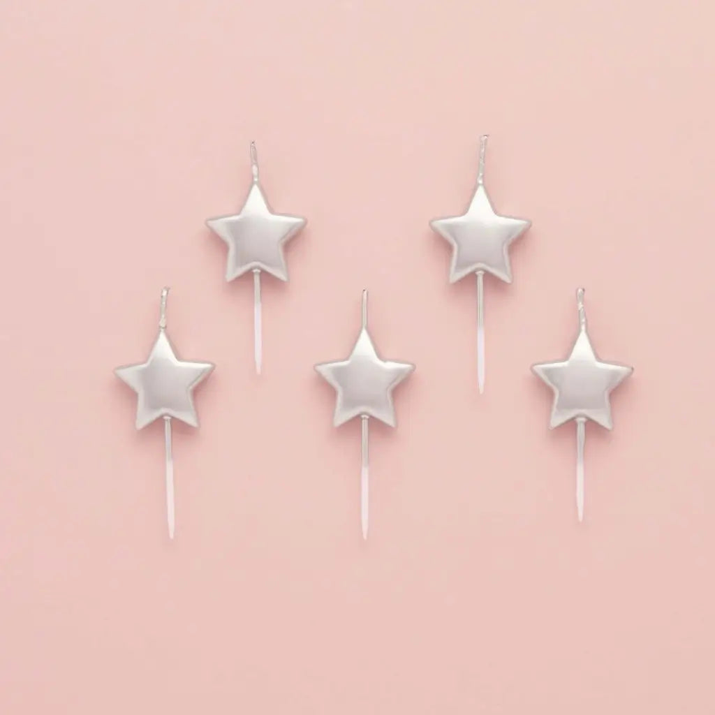 Metallic silver star candles for birthday cakes