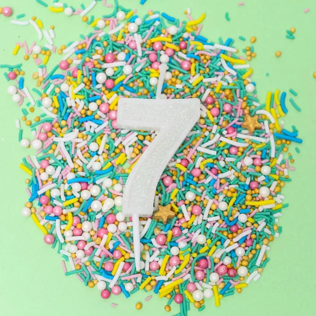 Mini white glitter number 7 candle for birthday cake
