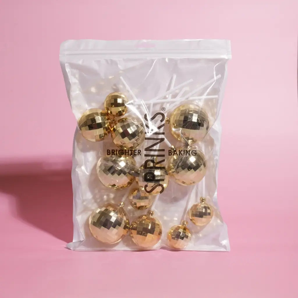 Mirrored gold cake balls in three assorted sizes