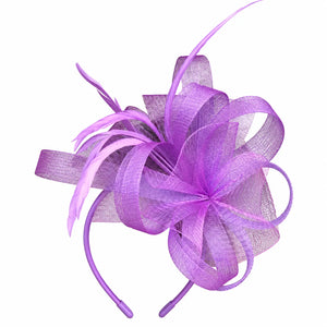 Emma purple loop and feather fascinator hair clip worn with loose curls