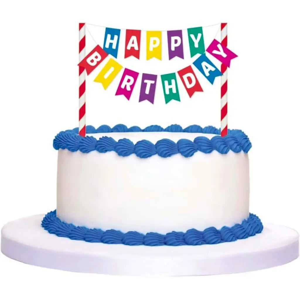 Multicoloured miniature flag banner displayed on a birthday cake