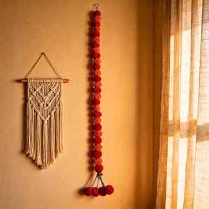 Orange and yellow marigold-inspired garland decorating an Indian wedding haldi ceremony backdrop