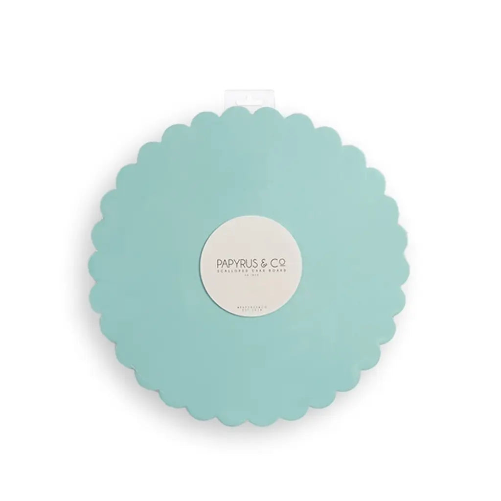 Round blue cake board with a decorative scalloped edge