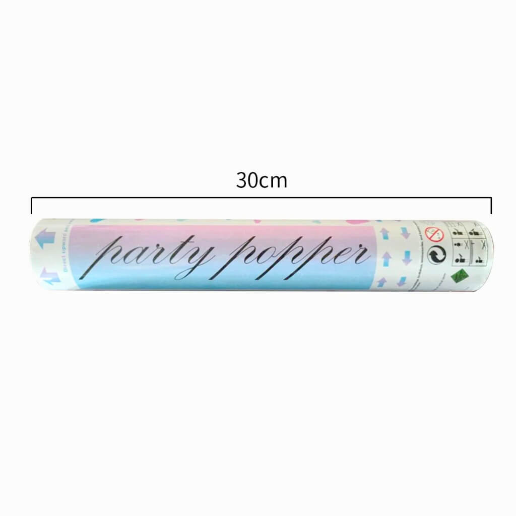 Gender reveal popper releasing foil heart confetti outdoors