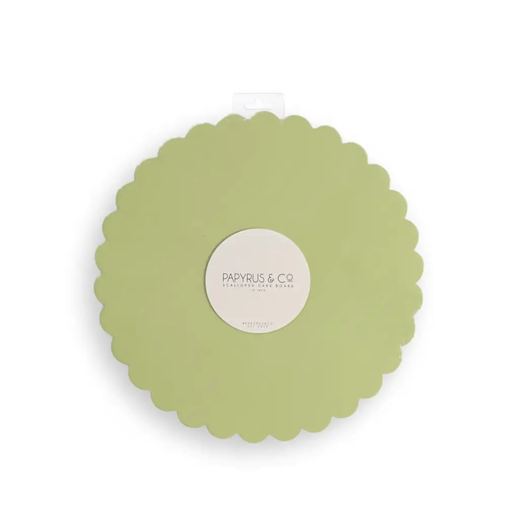 Pastel green round cake board with decorative scalloped edges