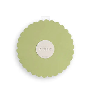 Pastel green round cake board with decorative scalloped edges