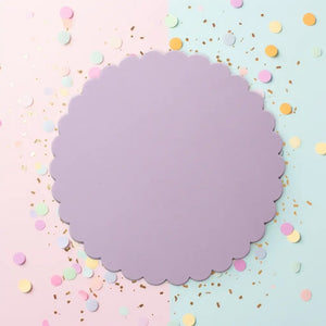 Round purple cake board with a decorative scalloped edge