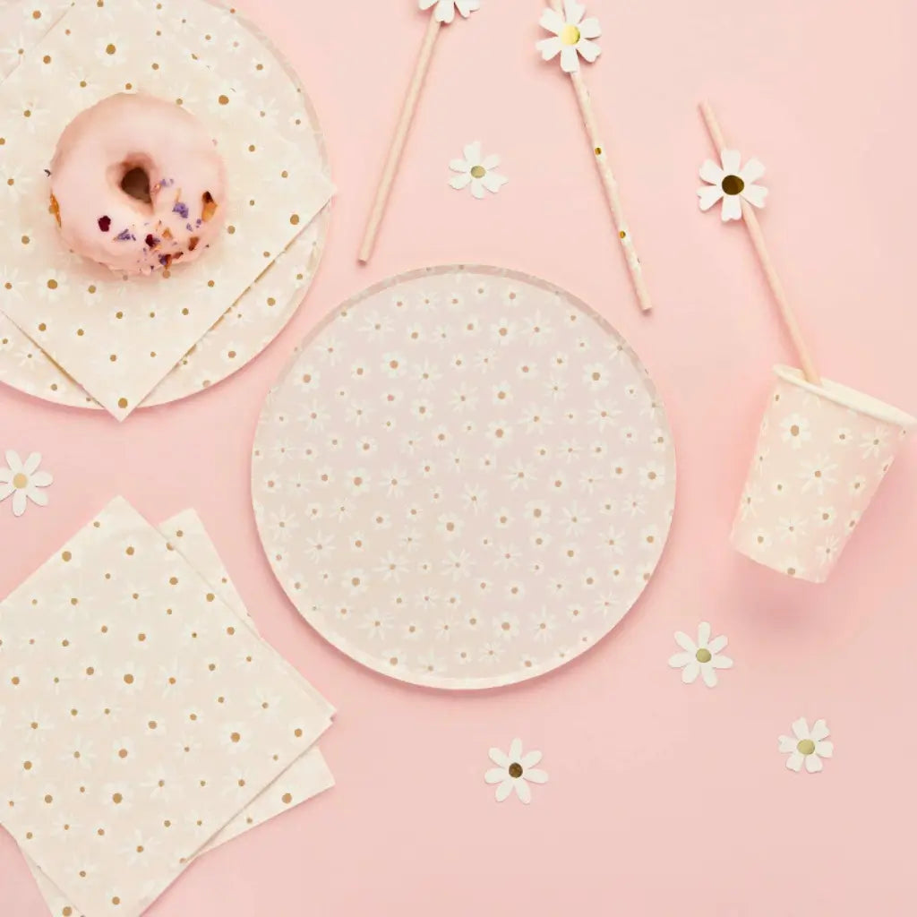 Pastel pink floral paper plates with white daisies and brown centres