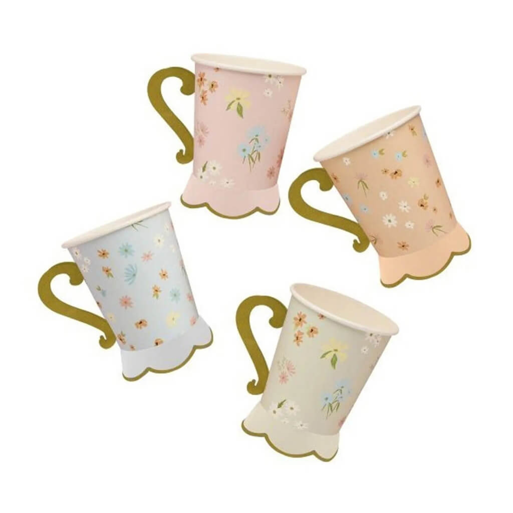 Pastel pink daisy party cups matching floral plates and napkins