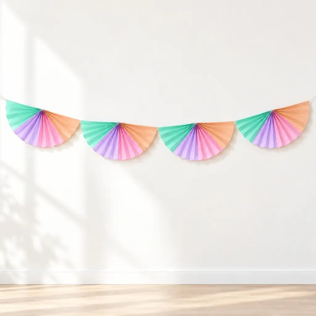 Pink lilac mint and peach paper fans joined as a party garland