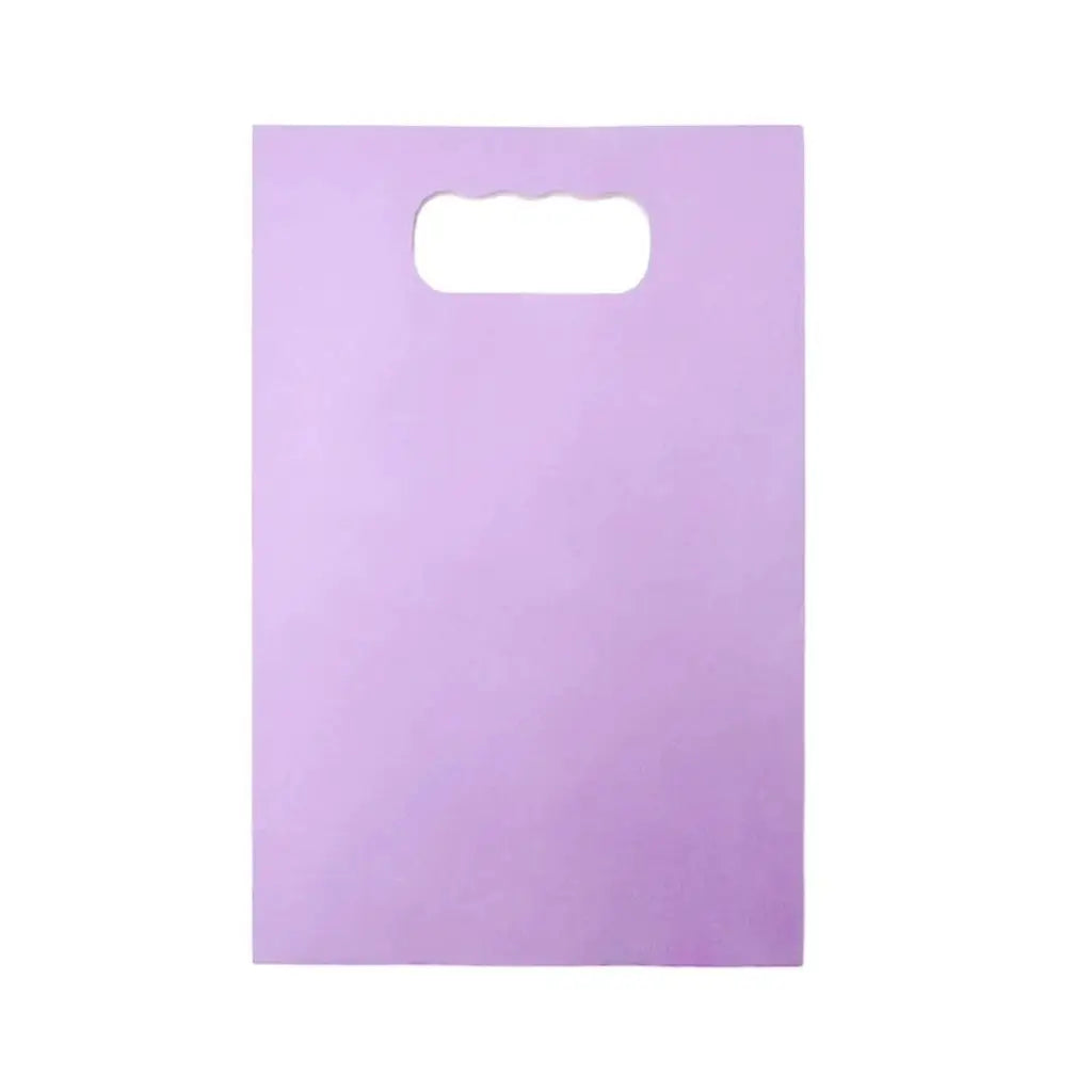 Purple paper treat bags for party giveaways