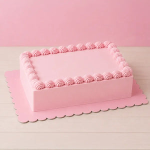 papyrus pastel pink rectangular cake board supporting a decorated cake