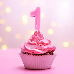 Single pink number 1 candle for milestone birthday cake