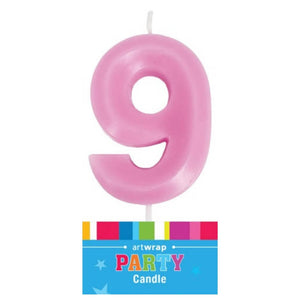 Single pink numeral 9 candle for birthday cake