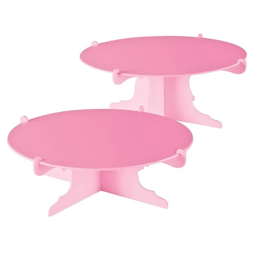 Two pink round party dessert display stands with interlocking bases