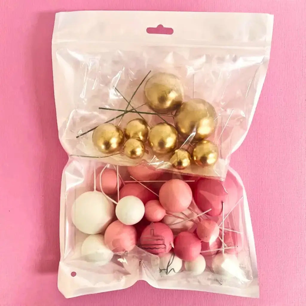 Pink and gold foam balls for cake decorating