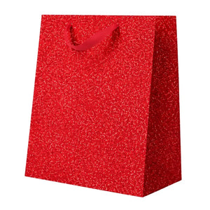 red Christmas glitter gift bag with matching ribbon handles