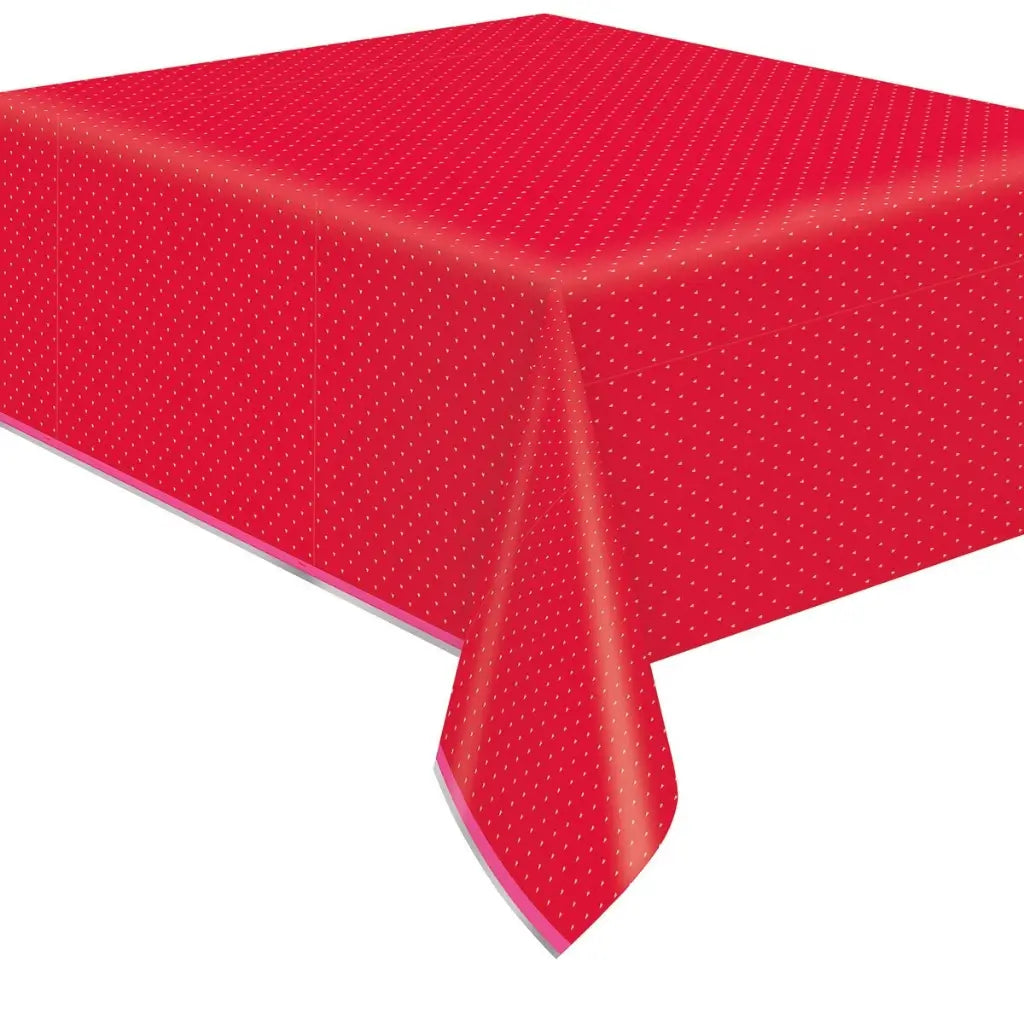 Red tablecloth with white polka dots on a white background