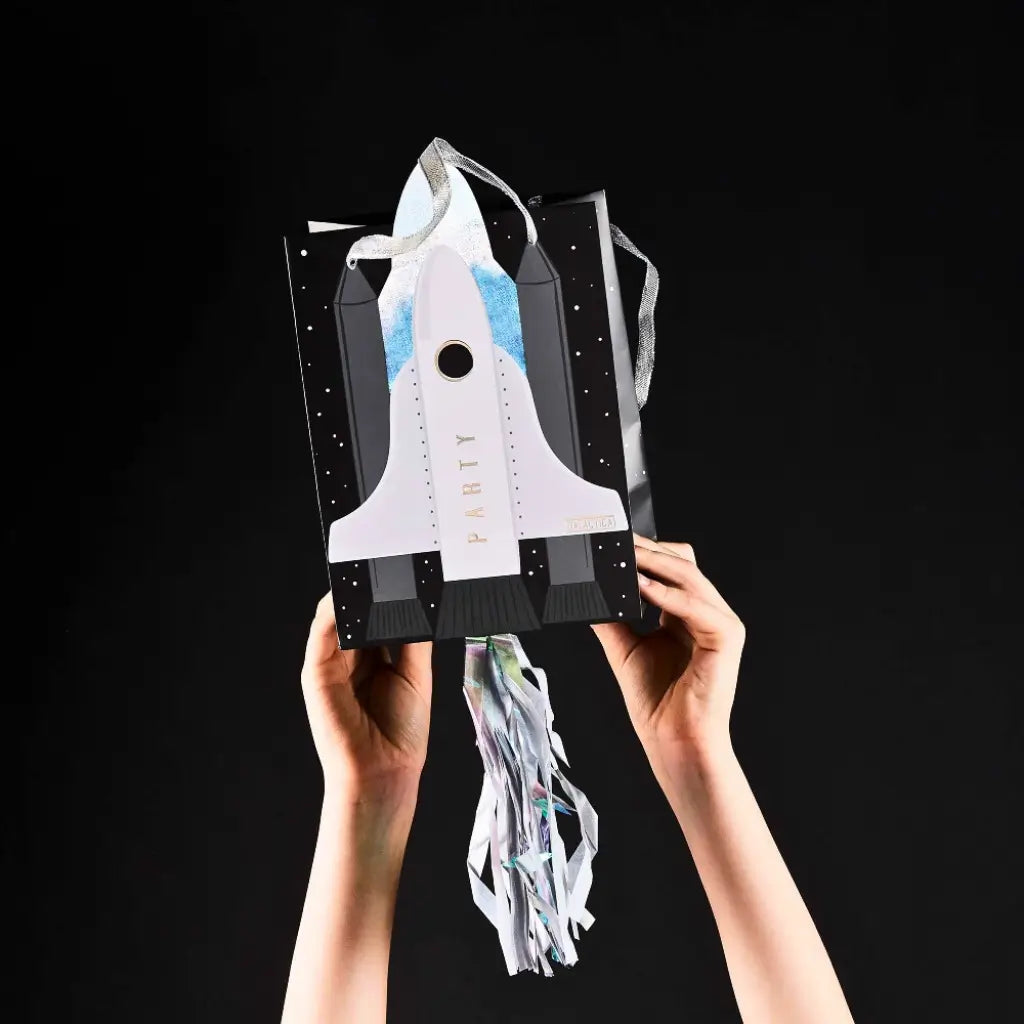 Space-themed treat bags with tassels for kids birthdays