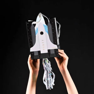 Space-themed treat bags with tassels for kids birthdays