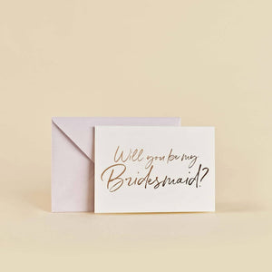 Rose gold foiled bridesmaid proposal cards with matching pink envelopes