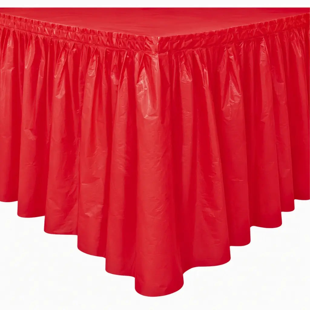  Ruby red plastic party table skirt with gathered pleats measuring 73cm high and 4.3m long