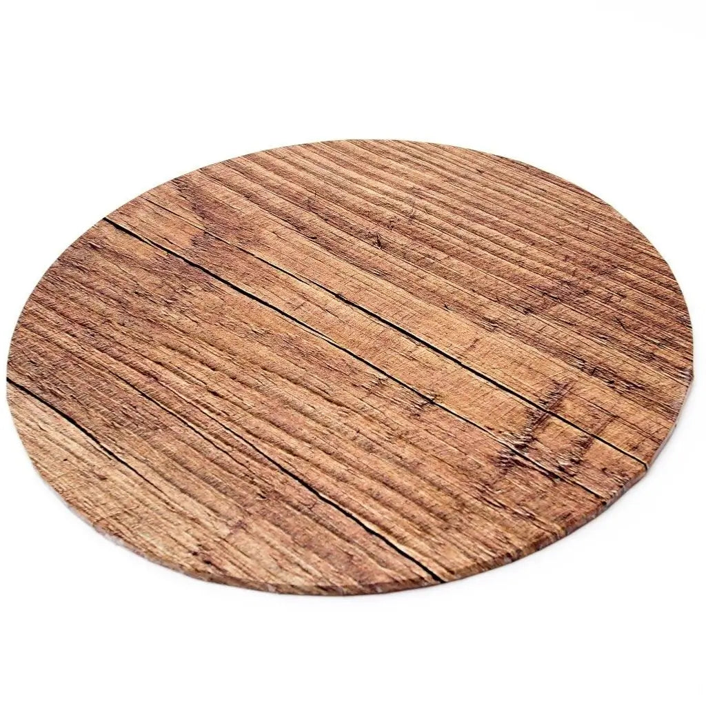 Close-up of the natural brown woodgrain and rustic timber-plank design on a round cake board
