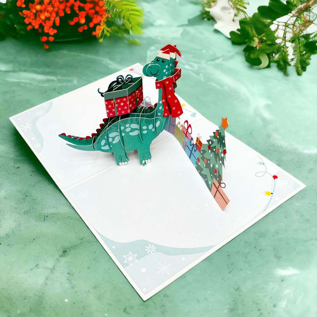Green Baby Dinosaur with Christmas Present Pop Card