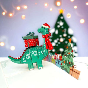Green Baby Dinosaur with Christmas Present Pop Card