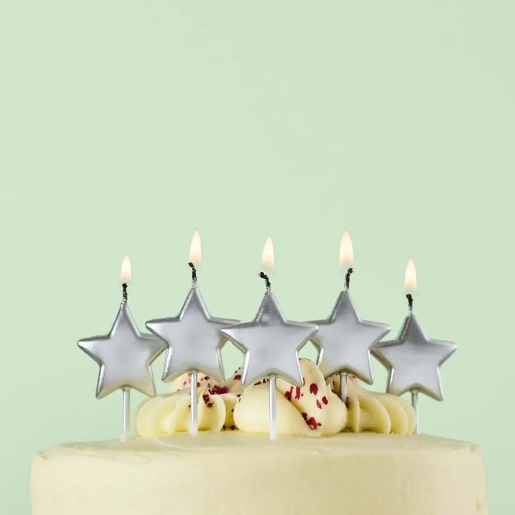 Metallic silver star candles for birthday cakes
