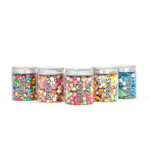 Five jars of Sprinkles on a white background