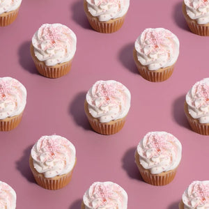 Tiny pink sugar sprinkles for decorating desserts on cupcakes