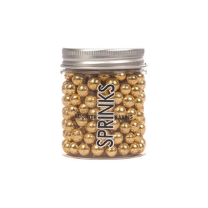 Gold dragee cake decorations in jar