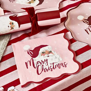 Vintage Santa paper napkins arranged on a Christmas dining table with festive decorations