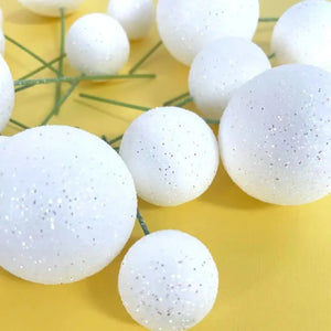 White decorative cake topper balls in assorted sizes