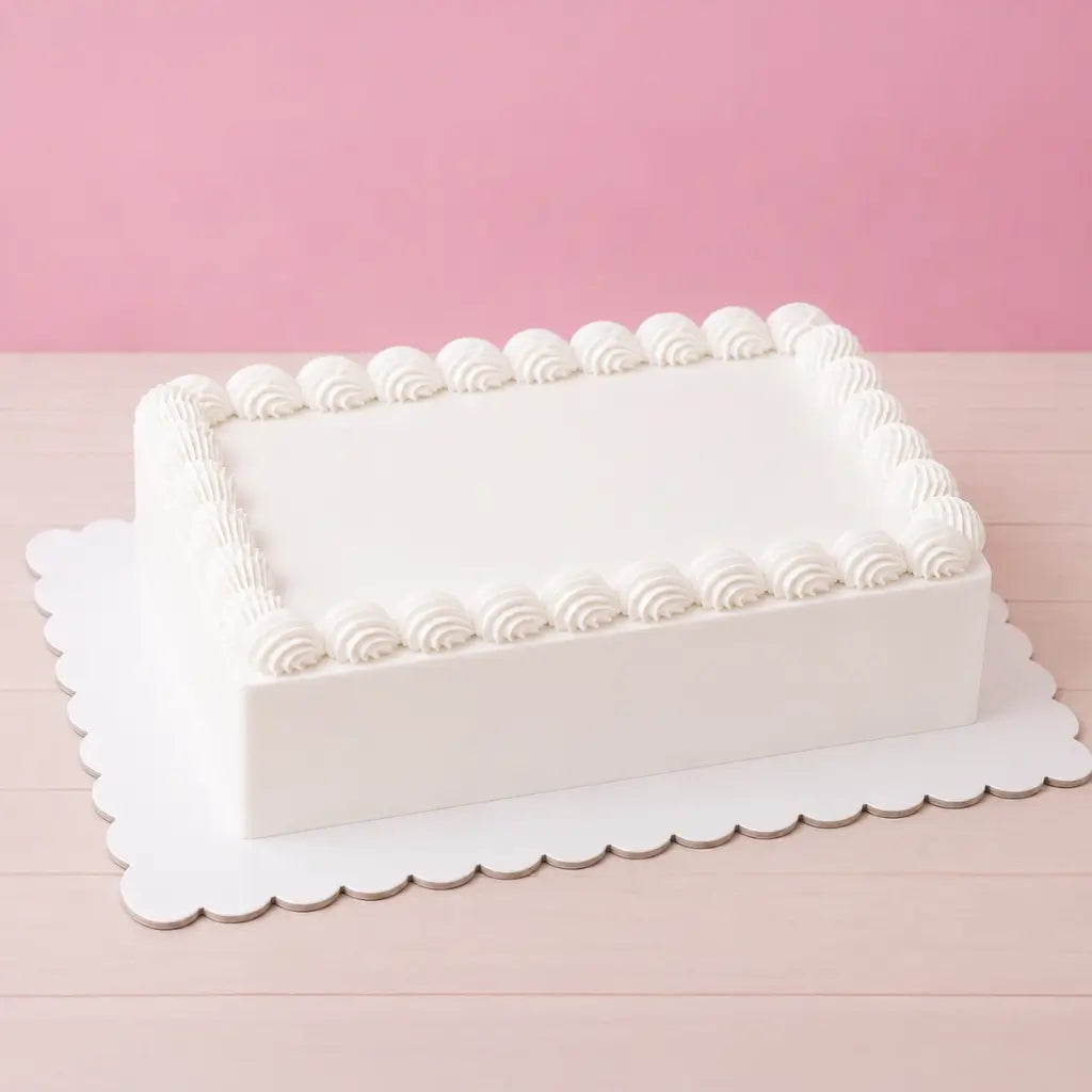 white rectangular cake board with decorative scalloped edges
