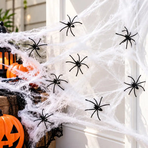 Fright Night stretchable white spider web with eight black spiders