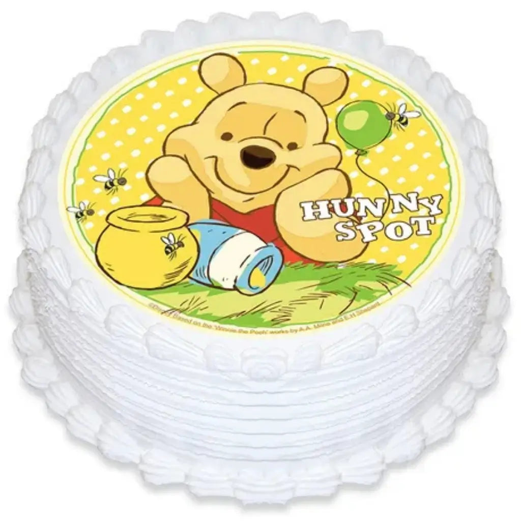 Winnie the Pooh and bees round edible cake image measuring 16cm