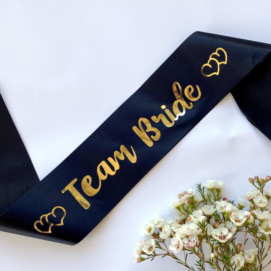 Black Team Bride with Hearts Hen Party Satin Sash - Gold Foil Print