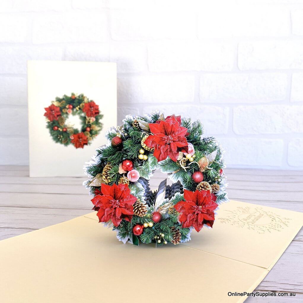 3D festive greeting card featuring red poinsettia and pine wreath
